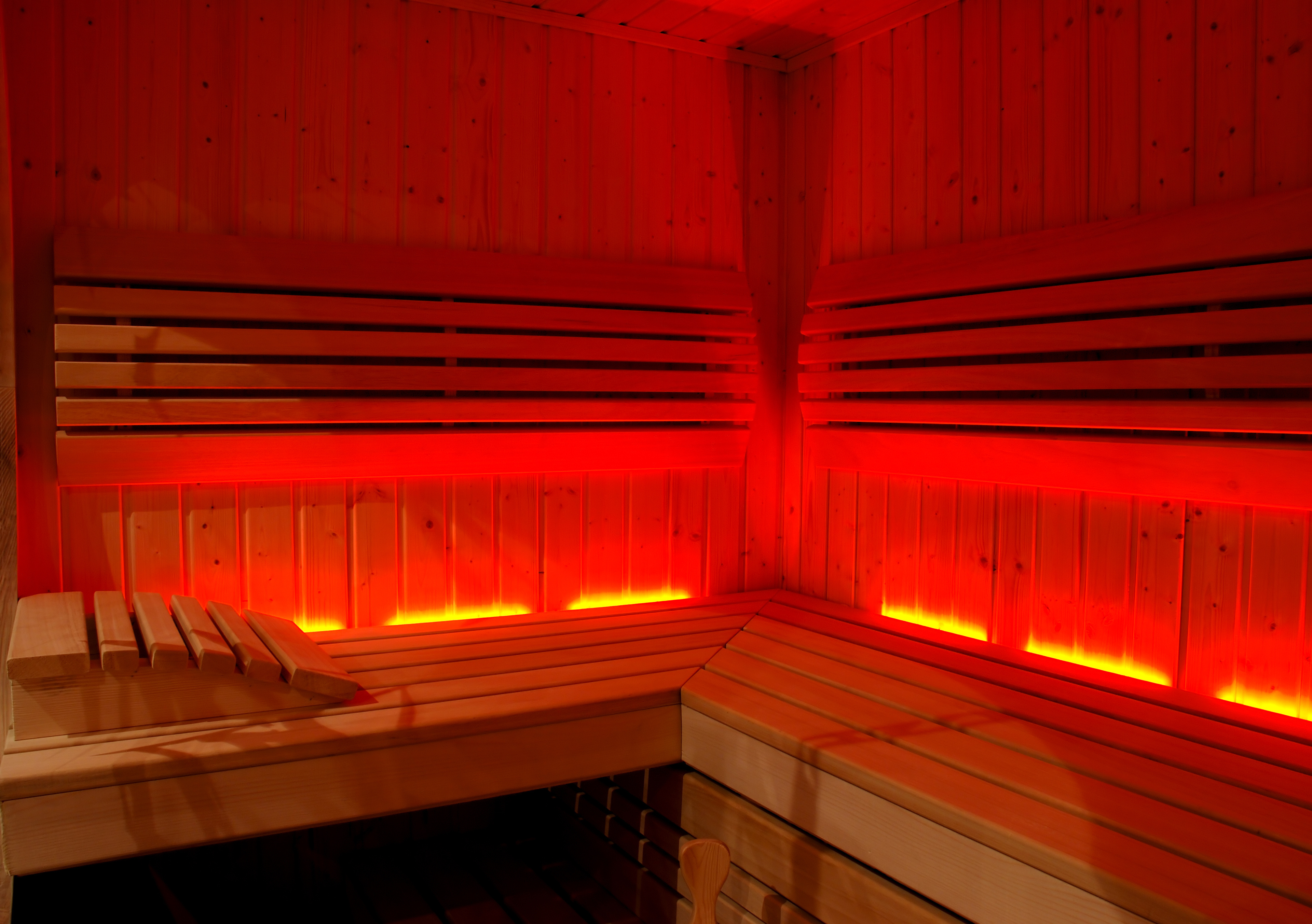 Sauna interior glowing in low warm light